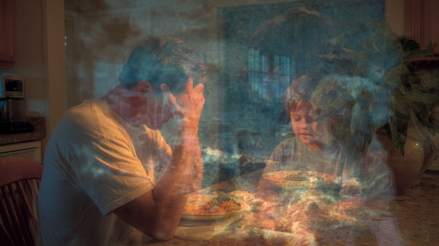 Overwhelmed parent reflecting on mealtime stress